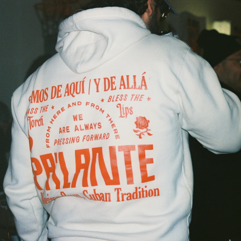 White hoodie with red text and branding on the back